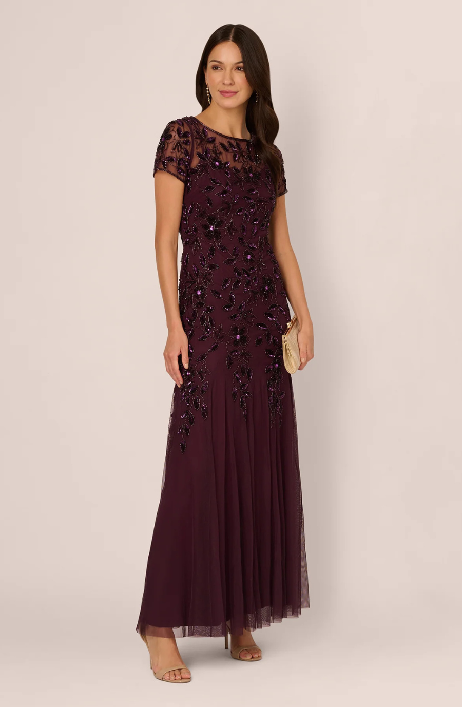 model is wearing a beaded. burgundy short sleeve mothers dress