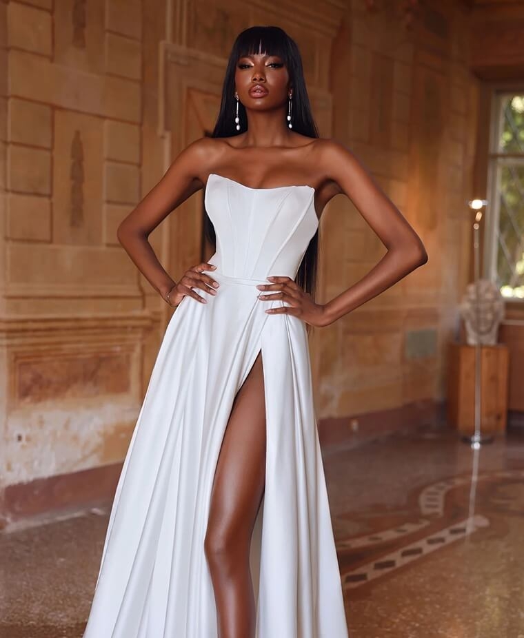 Model wearing a white gown by Virginia Jane